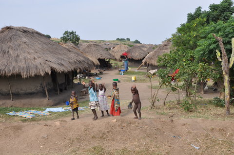 Waving children as we pass through a village.  No, I did not kill their chicken.